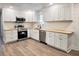 Updated kitchen with white cabinets, stainless steel appliances, and wood countertops at 1848 Merrick Dr, Round O, SC 29474