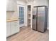Kitchen with modern appliances, stylish cabinets, and convenient access to the backyard at 1848 Merrick Dr, Round O, SC 29474