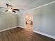 Bright living room featuring hardwood floors, modern ceiling fan and neutral paint at 1848 Merrick Dr, Round O, SC 29474