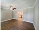 Bright living room featuring hardwood floors, modern ceiling fan and neutral paint at 1848 Merrick Dr, Round O, SC 29474