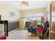 Bedroom with a window, carpeted floor, and neutral-toned walls with decorative trim at 1876 Chilhowee Dr, Johns Island, SC 29455