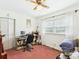 Bedroom with desk, computer, and natural light from the large windows at 1876 Chilhowee Dr, Johns Island, SC 29455