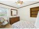 Charming bedroom features a wood dresser with mirror and floral bedding at 1876 Chilhowee Dr, Johns Island, SC 29455