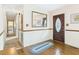 Welcoming foyer with hardwood floors, a decorative front door, and a view into the hallway at 1876 Chilhowee Dr, Johns Island, SC 29455