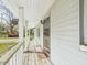 Welcoming front porch with white chairs offers a comfortable outdoor space at 1876 Chilhowee Dr, Johns Island, SC 29455