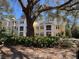 Charming yellow building with beautiful landscaping and mature trees draped with Spanish moss at 1928 Chatelain Way, Mount Pleasant, SC 29464