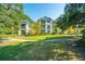 Well-maintained building exteriors with green grass and tree lined walkway at 1928 Chatelain Way, Mount Pleasant, SC 29464