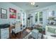 Bright living room features hardwood floors, many windows, and comfortable seating at 1928 Chatelain Way, Mount Pleasant, SC 29464