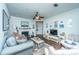 Inviting living room featuring a fireplace, hardwood floors, and comfortable seating arrangements at 1928 Chatelain Way, Mount Pleasant, SC 29464