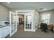 Well-appointed office space with natural light, a comfortable desk, and a view of the community library at 1928 Chatelain Way, Mount Pleasant, SC 29464