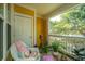 Cozy outdoor patio with wicker chair and view of lush greenery at 1928 Chatelain Way, Mount Pleasant, SC 29464