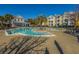 Expansive pool area with lush palm trees and comfortable lounge chairs, perfect for relaxation and recreation at 1928 Chatelain Way, Mount Pleasant, SC 29464