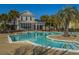 Inviting pool surrounded by palm trees, creating a serene and resort-like atmosphere for residents to enjoy at 1928 Chatelain Way, Mount Pleasant, SC 29464