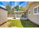 A fenced backyard with a screened-in porch and a storage shed at 201 Miami St, Ladson, SC 29456