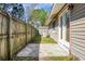 Backyard featuring concrete patio, some sparse grass, and an exposed storage shed at 201 Miami St, Ladson, SC 29456