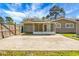 The backyard features a spacious patio with a fenced yard and a screened in back porch at 201 Miami St, Ladson, SC 29456