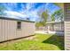 A nice view of a fenced backyard, shed, and screened-in porch at 201 Miami St, Ladson, SC 29456