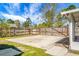 Spacious backyard with a concrete patio, partial privacy fence, and storage building at 201 Miami St, Ladson, SC 29456