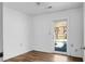 This bedroom has light walls, hardwood flooring, and an access door to the outside at 201 Miami St, Ladson, SC 29456