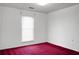 A bedroom with red carpet, a large window with blinds, and white walls is visible at 201 Miami St, Ladson, SC 29456