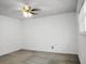 Bright, unfurnished bedroom features a ceiling fan, window with blinds, and gray carpets at 201 Miami St, Ladson, SC 29456