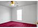 A bedroom with red carpet, white walls, and a window covered by blinds is visible at 201 Miami St, Ladson, SC 29456
