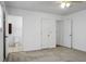 Unfurnished bedroom features a carpet, multiple doors including one to a bathroom at 201 Miami St, Ladson, SC 29456