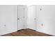This bedroom offers hardwood flooring and two closets, with neutral walls and base trim at 201 Miami St, Ladson, SC 29456