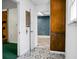 Hallway with decorative flooring, offering access to multiple rooms at 201 Miami St, Ladson, SC 29456
