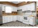 Bright kitchen with white cabinets, butcher block countertops and decorative flooring at 201 Miami St, Ladson, SC 29456