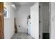 Clean laundry room with a window and shelving for storage solutions at 201 Miami St, Ladson, SC 29456