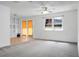 Bright living space with large windows, built-in shelving, and access to the backyard, ideal for relaxation at 201 Miami St, Ladson, SC 29456