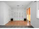 Versatile living area with built-in shelving and glass-paneled cabinets, offering ample storage and display space at 201 Miami St, Ladson, SC 29456