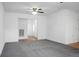 Spacious living area with neutral carpet, white walls, and an open layout, perfect for entertaining guests at 201 Miami St, Ladson, SC 29456
