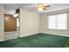 Living room offering green carpet and plenty of natural light through a window at 201 Miami St, Ladson, SC 29456