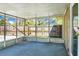 A view of the screened-in porch showing the metal screening and concrete flooring at 201 Miami St, Ladson, SC 29456