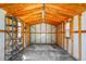 Interior view of the shed, with exposed wooden framing, shelving, and a concrete floor at 201 Miami St, Ladson, SC 29456