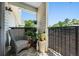 Cozy balcony with wicker furniture and potted plants, offering a serene outdoor space at 2011 N Highway 17 # 1100I, Mount Pleasant, SC 29466