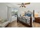 Charming bedroom with hardwood floors, decorative ceiling fan, and a large window with natural light at 2011 N Highway 17 # 1100I, Mount Pleasant, SC 29466