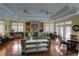 Community center with comfortable seating areas, fireplace, TV, and dining tables for residents at 2011 N Highway 17 # 1100I, Mount Pleasant, SC 29466