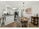 Dining area adjacent to kitchen with modern lighting and stylish furnishings at 2011 N Highway 17 # 1100I, Mount Pleasant, SC 29466
