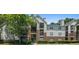 Attractive multi-story condo building with brick accents and mature landscaping at 2011 N Highway 17 # 1100I, Mount Pleasant, SC 29466