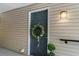 Charming front door with a decorative wreath and stylish outdoor lighting at 2011 N Highway 17 # 1100I, Mount Pleasant, SC 29466