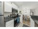 Efficient kitchen with granite counters, stainless steel appliances, and bright lighting at 2011 N Highway 17 # 1100I, Mount Pleasant, SC 29466