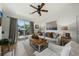 Bright living room with sliding glass doors, ceiling fan and modern decor at 2011 N Highway 17 # 1100I, Mount Pleasant, SC 29466