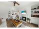 Open-concept living room with fireplace, kitchen access, and modern decor at 2011 N Highway 17 # 1100I, Mount Pleasant, SC 29466