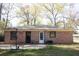 Brick house with a patio and a small well-maintained backyard at 208 Owens Dr, Summerville, SC 29485