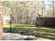 Backyard with green grass and a wooden fence with a lamp post at 208 Owens Dr, Summerville, SC 29485