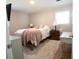 Bedroom with a queen bed, soft carpet, and a large window at 208 Owens Dr, Summerville, SC 29485
