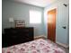 Bedroom featuring light blue walls, natural light, dark wood dresser and hardwood floors at 208 Owens Dr, Summerville, SC 29485